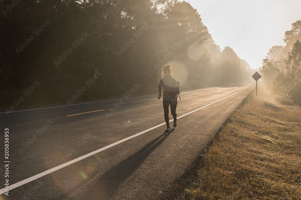 Happy Asian girl backpack in the road and forest background, Happy Asian girl backpack in the road and forest background,