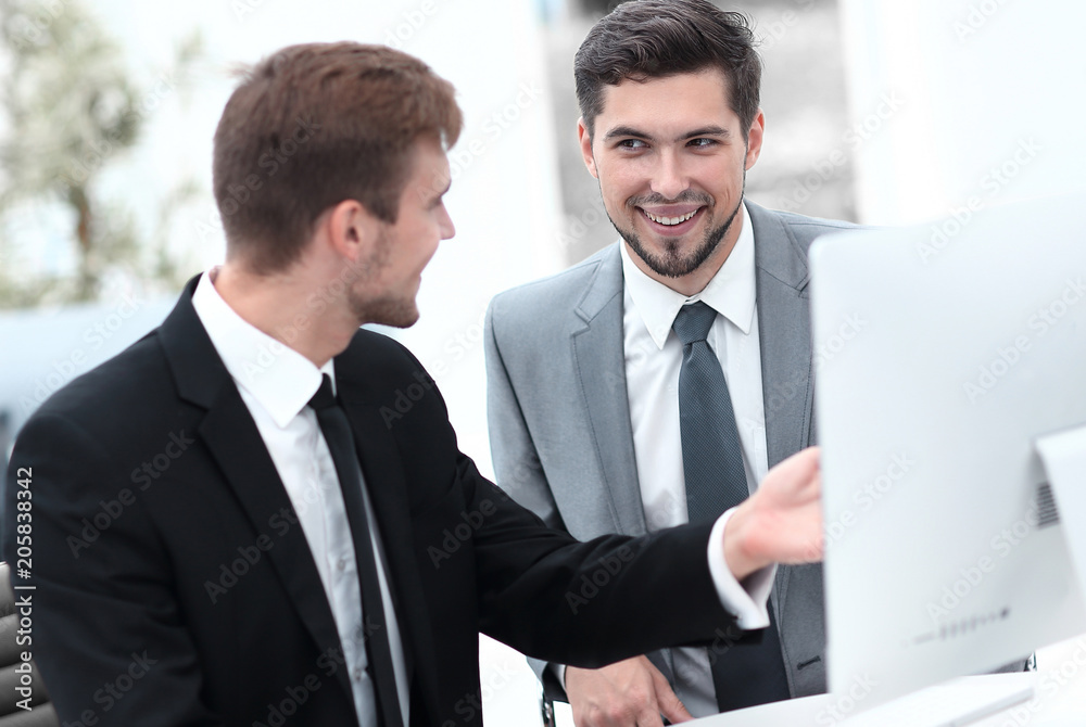 employees are talking sitting behind a Desk employees are talking sitting behind a Desk