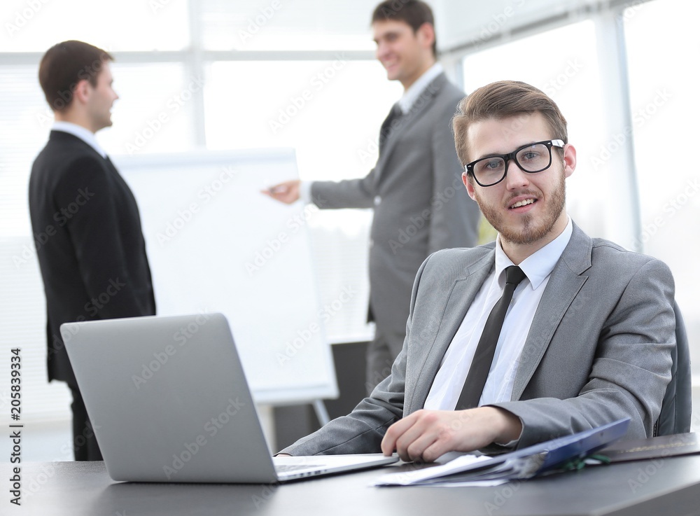 successful businessman sitting at Desk in office successful businessman sitting at Desk in office