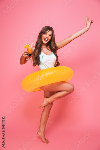 Full length portrait of an excited young woman
