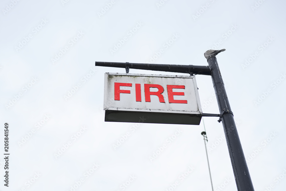 Fire station sign in sky blank post single isolated red white Fire station sign in sky blank post single isolated red white