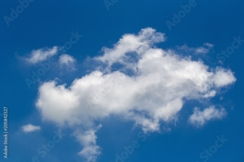 White fluffy clouds in the blue sky background