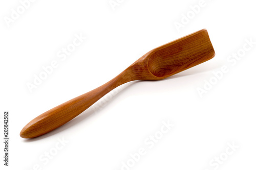 Empty wooden scoop isolated on a white background