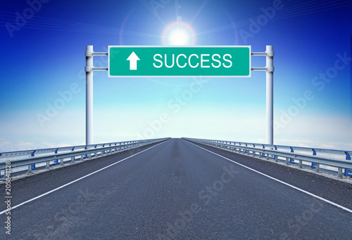 Straight motorway with a text Success on the road sign. Concept of movement to successful life