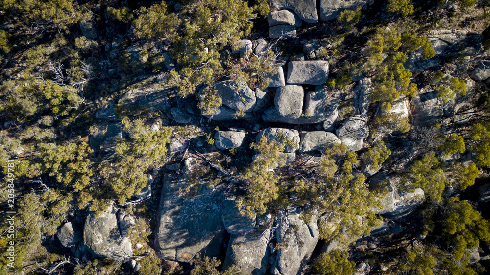 Obraz premium Aerial drone view over wineries and granite rock in Stanthorpe, Australia