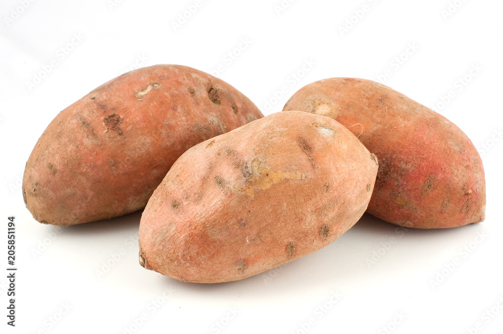 Three sweet potatoes isolated on white background Three sweet potatoes isolated on white background