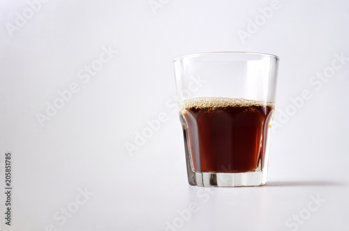 Transparent glass cup with hot coffee drink