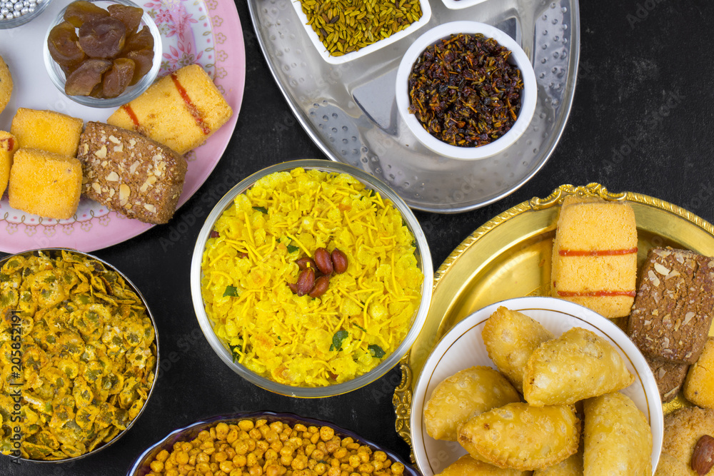 Indian Group of Diwali and Holi Celebration Food Namkeen, Chivda, Chiwada, Karanji, Namkin, Nimco, Mixture Namkeen, Masala Chana, Gujiya, Chana Chor Garam, Cookies, Biscuits or Mouth Freshner