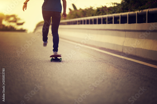 Skateboarder skateboarding on city street