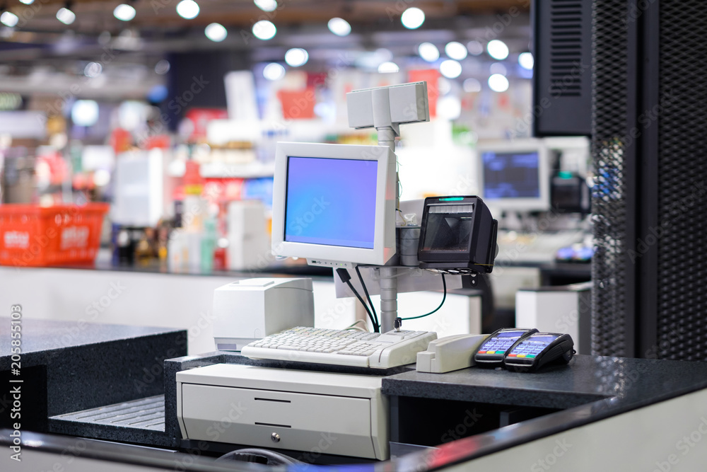 Cash desks with card payment terminals on blurry background