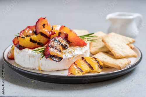 Baked Camembert cheese with grilled peach