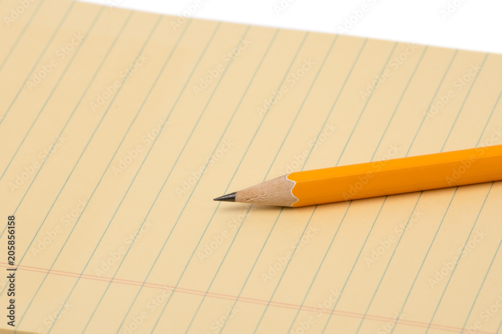 notebook and pencil isolated on white background notebook and pencil isolated on white background