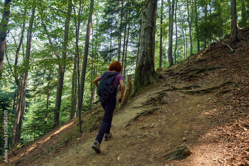 Woman hiking on a mountain trail