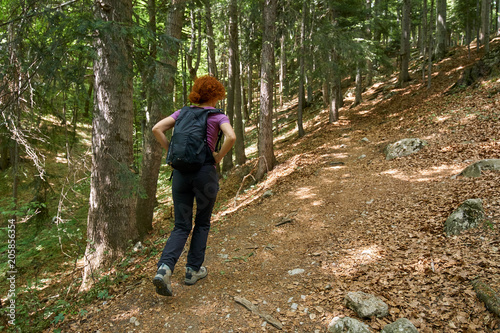 Woman hiking on a mountain trail