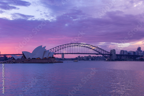 opera house and harbour bridge in Sydney at sun clouds in twilight time,They are iconic landmarks of Australia .Australia © Kitsada