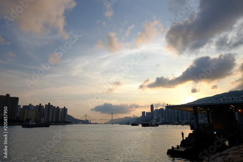 Beautiful sunset view with sky building and the sea in Hong Kong 