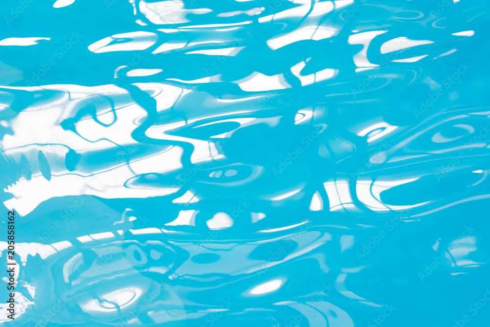 Blue pool water with sun reflections. Abstract blurred pattern. Blue pool water with sun reflections. Abstract blurred pattern.