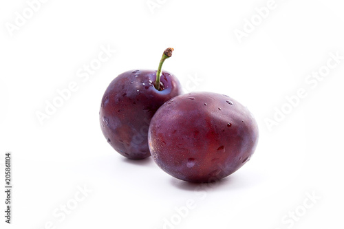 Group of ripe plums isolated on a white background..