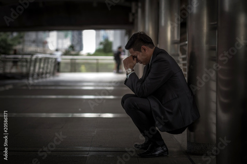 Business man tired or stressed after his work. Image of Stressed businessman concept.