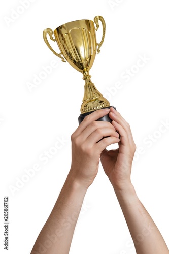 Raised hands of a man are holding trophy. Isolated on white background.