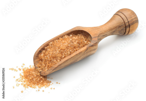 Brown sugar in wooden scoop