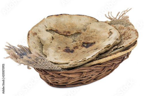 Rajasthani Bajra Roti or Bajri Roti in Basket isolated on White Background