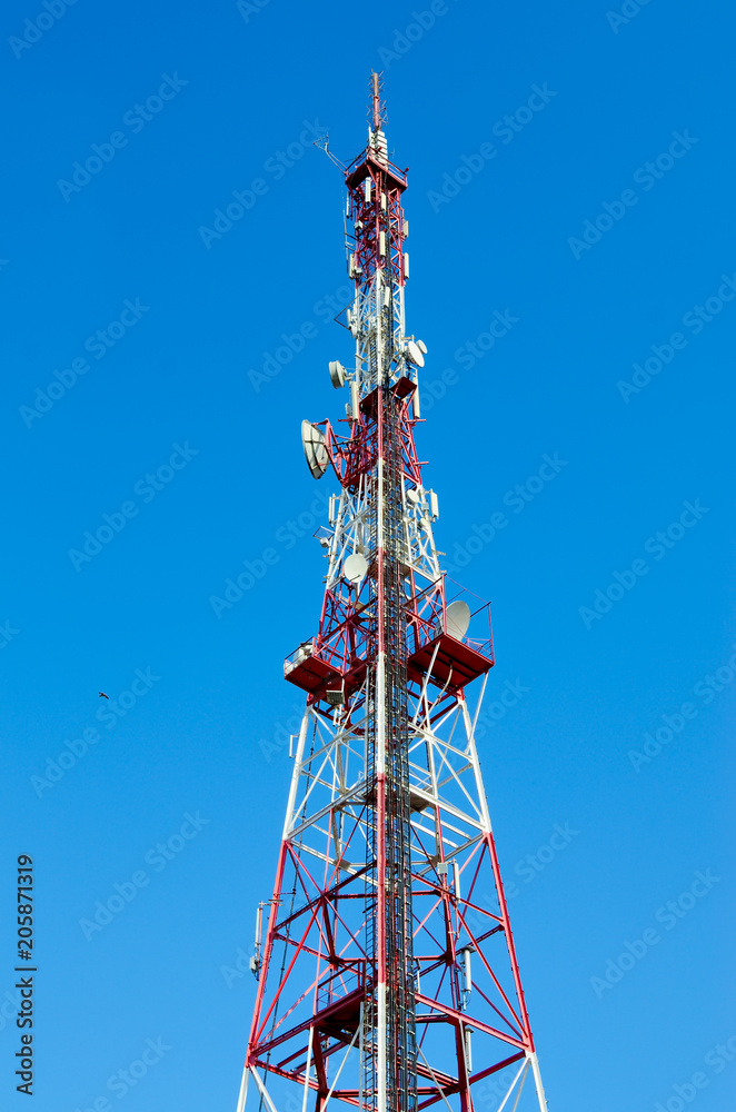 High television tower against the blue sky High television tower against the blue sky