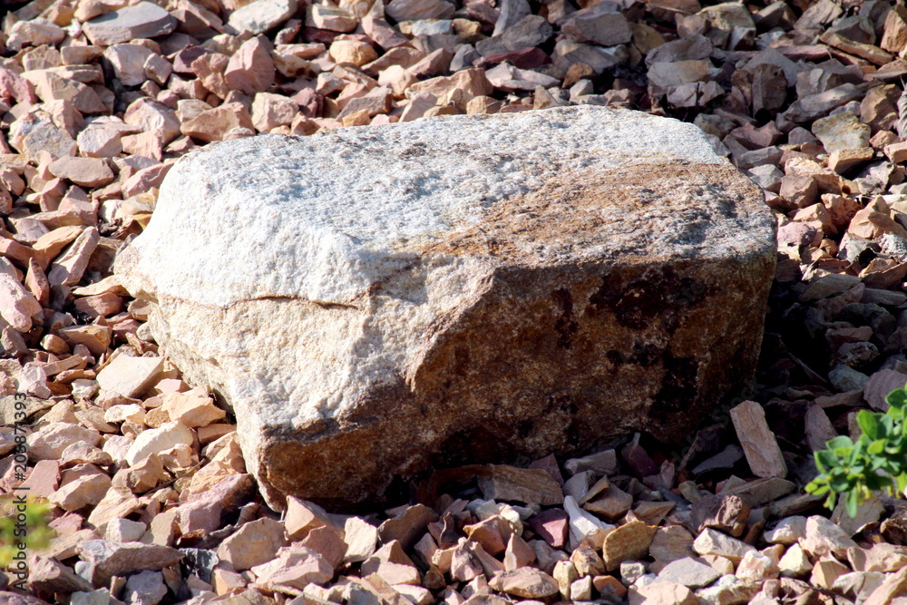 Fototapeta premium large stone in fine crushed stone