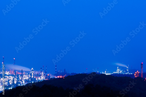 Aerial view Oil refinery.Industrial view at oil refinery plant form industry zone with sunrise and cloudy sky. and Petrochemical background sunset.