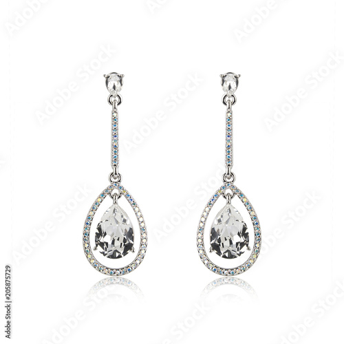 Pair of diamond earrings isolated on white