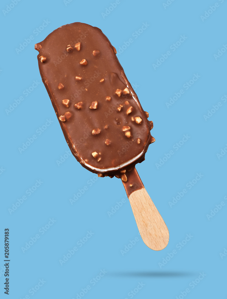 Chocolate popsicle. Ice cream on blue Chocolate popsicle. Ice cream on blue