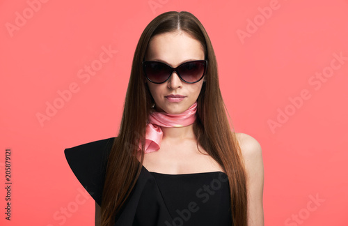 brunette woman is wearing sunglasses