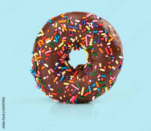 фотография chocolate donut on blue