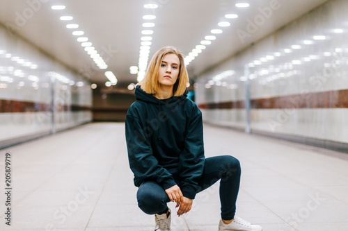 beautiful young blonde girl in an underpass