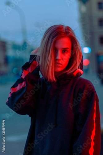 portrait of a girl in red blue in the street photo