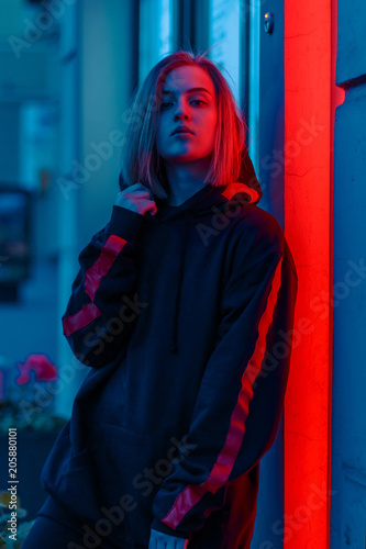 portrait of a girl in red blue in the street