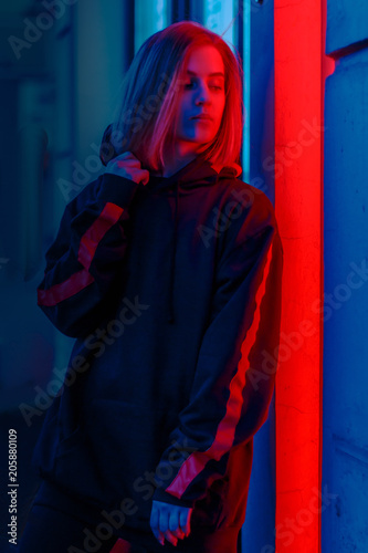 portrait of a girl in red blue in the street