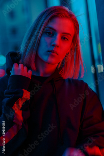 portrait of a girl in red blue in the street
