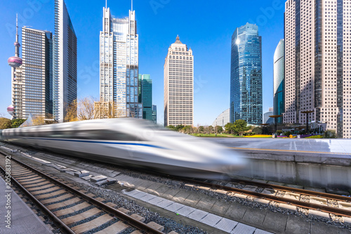 high speed train with city skyline in shanghai