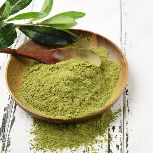 Japanese green tea matcha in a wooden bowl photo