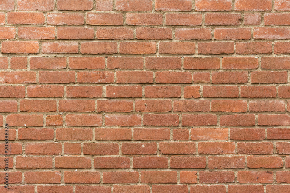 Close-up light red colored brick wall