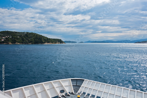 Ferry to Skiathos island with dramatic clouds over aegean sea in Greece © banepetkovic