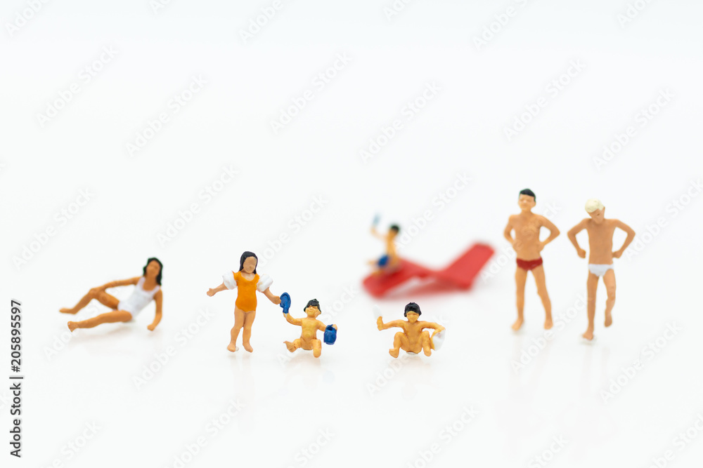 Obraz premium Miniature people : children in swimsuit and friends. Image use for holiday, vacation concept.