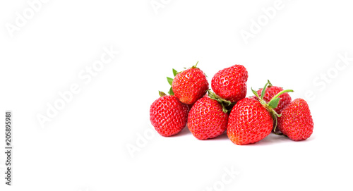Fresh ripe strawberries. Red fresh berries with green leaves on white background. Shallow depth of field photography. blank space