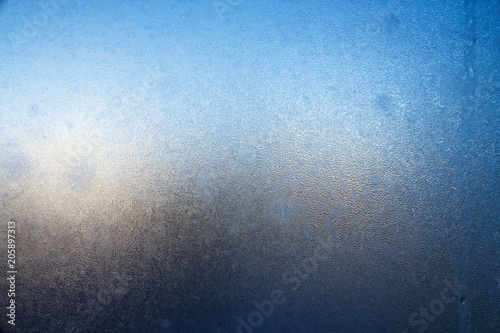 Frost on window glass close up abstract background photo texture