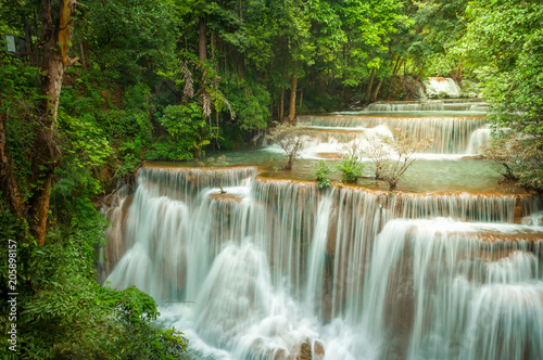 Beautiful and Breathtaking green waterfall at the tropical rain forest, Erawan's waterfall, Located Kanchanaburi Province, Thailand