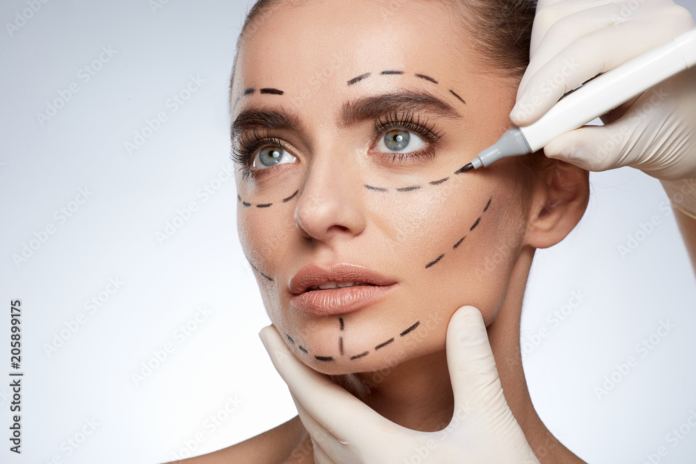 Beautiful girl with puncture lines on face