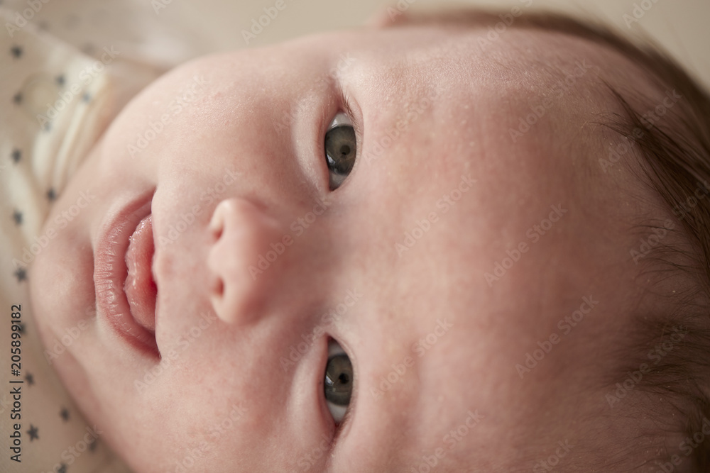 Close Up Of Newborn Baby Boy Lying On Changing Table In Nursery Close Up Of Newborn Baby Boy Lying On Changing Table In Nursery