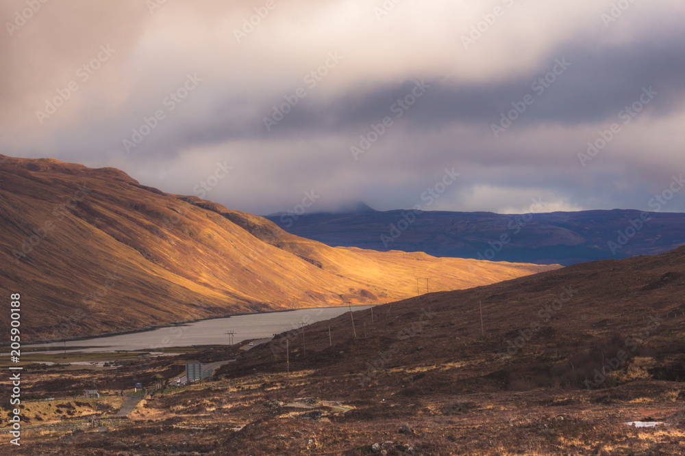 Isle of Skye, dramatic landscape with sunbeam shinning on a mountainside.