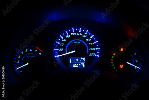 Closeup dashboard of mileage car with 
color light